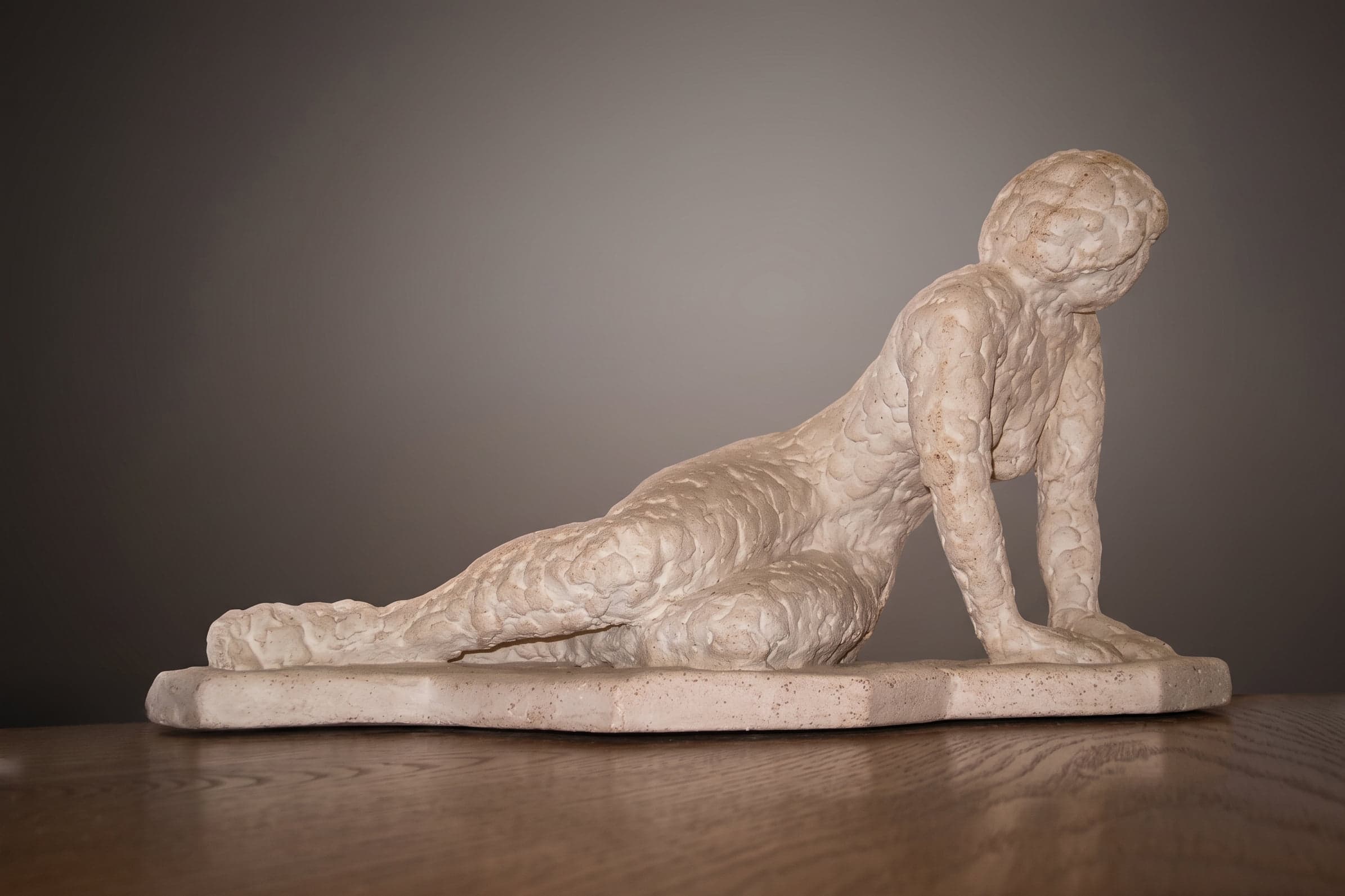 Woman reclining, Cast stone, W 66 × H 32 × D 33 cm